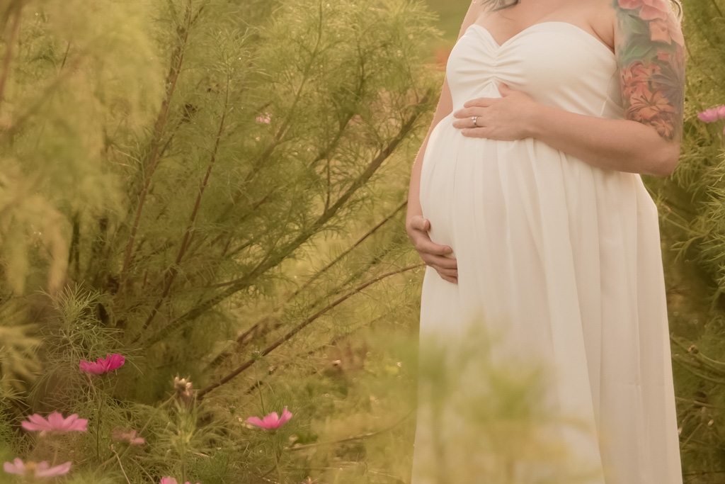 outdoor maternity session in wild flower field