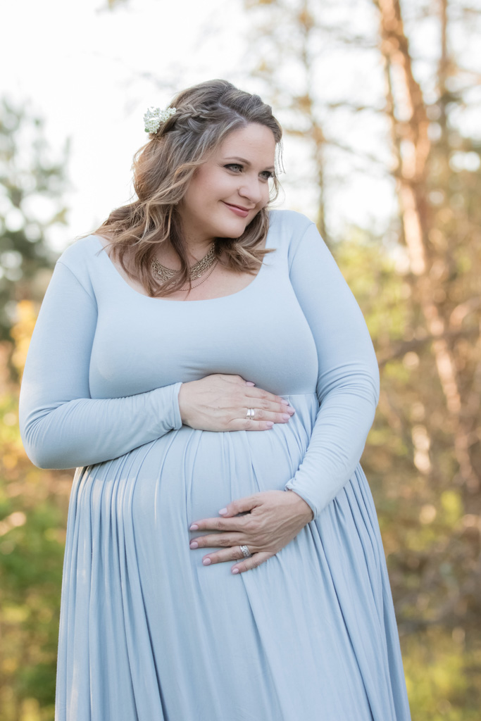 outdoor maternity session in field with fresh flowers