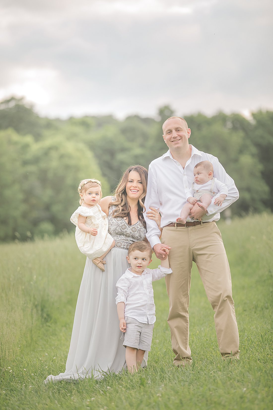 styled family in field at sunset_petite magnolia photography