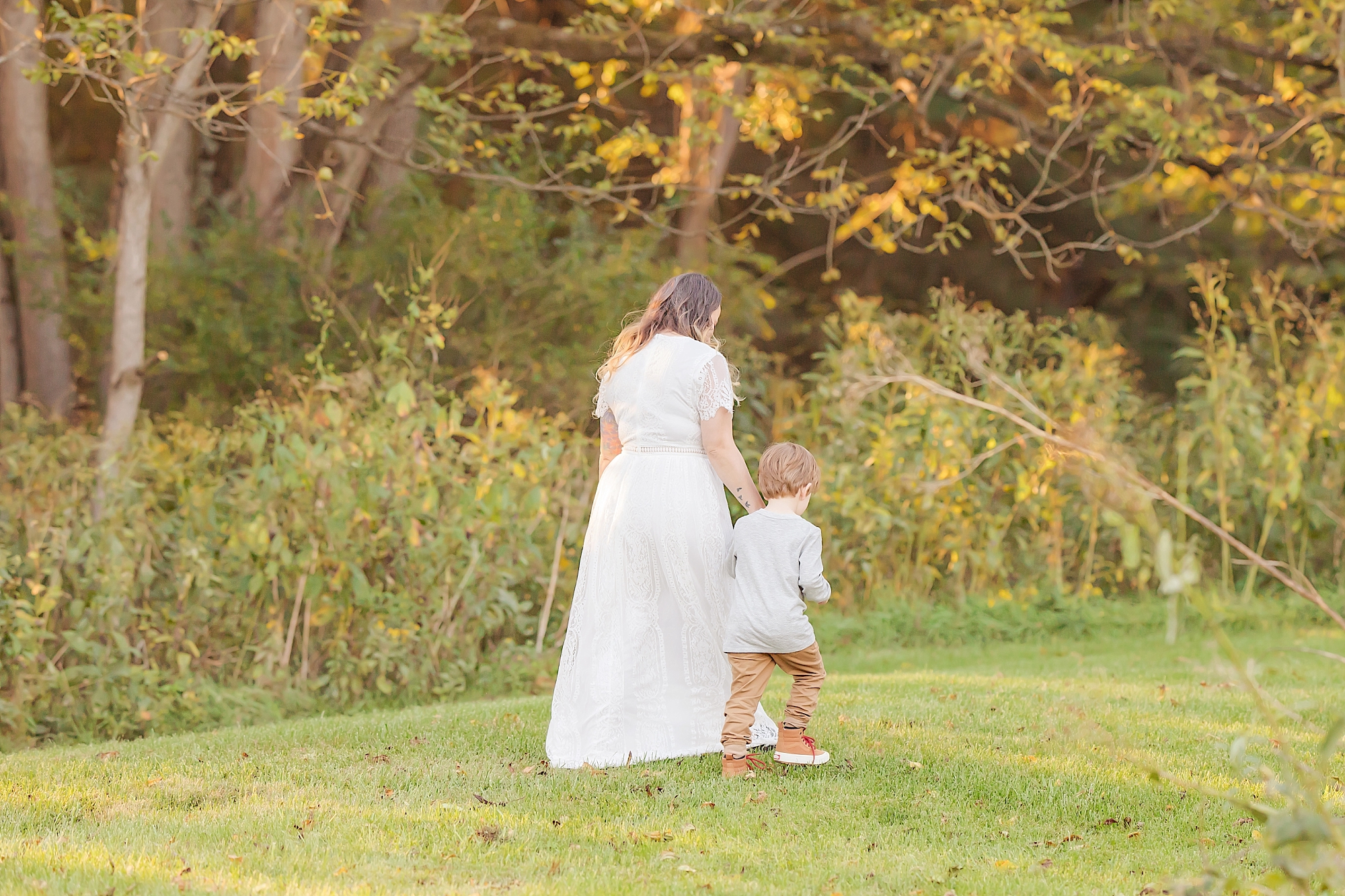 mother and son walking during photo shoot