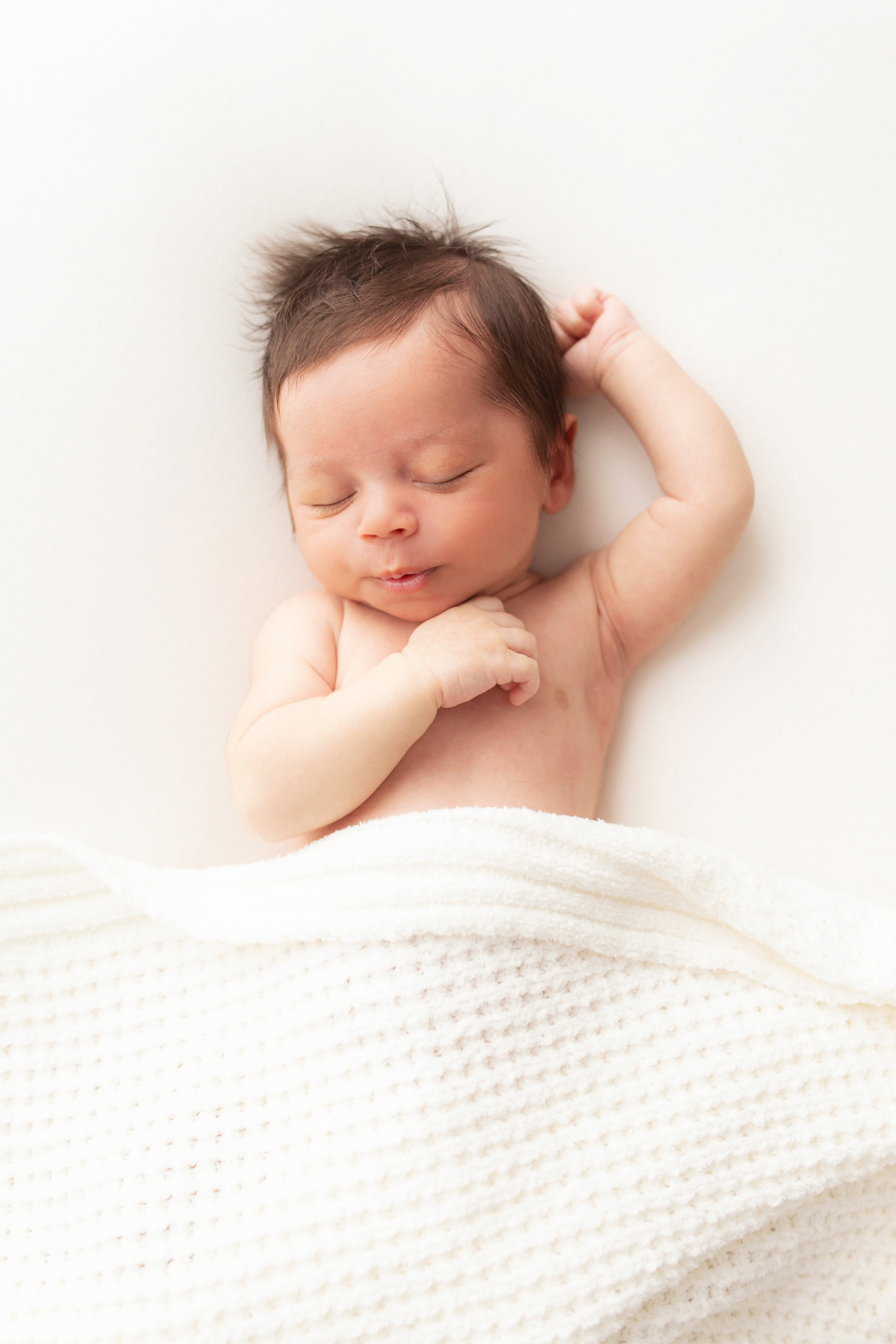 newborn boy sleeping during newborn photos in Pittsburgh