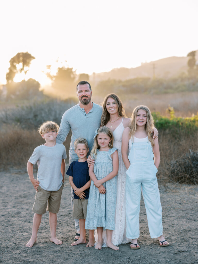 family standing on Malibu Beach bluff