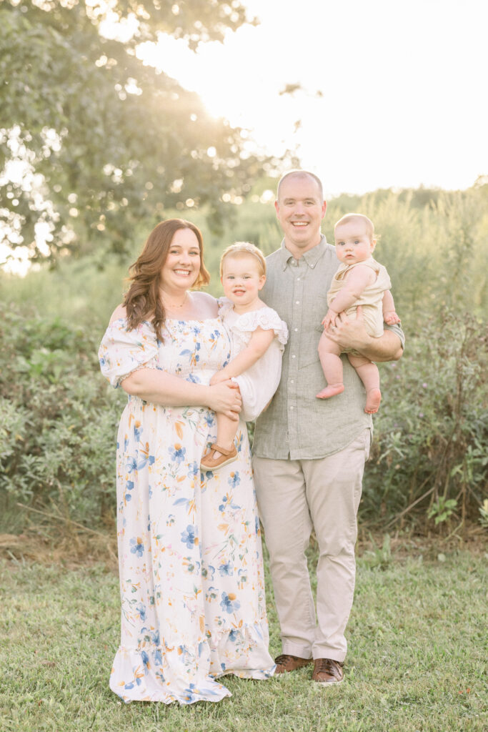 young family styled by petite magnolia photography at sunset for family photos
